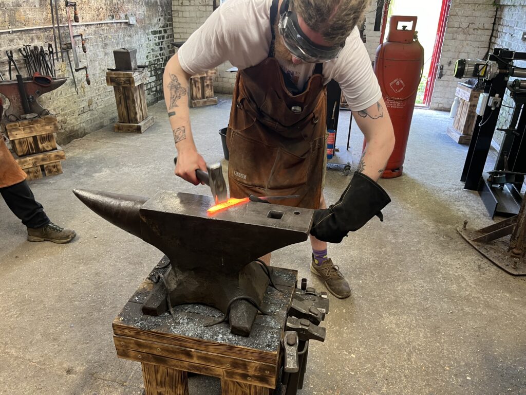 Dan demonstrating on the anvil